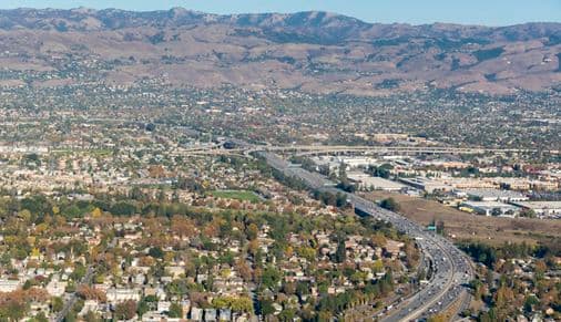 Interstate 280 snakes through San Jose, in the distance is the US 101 interchange.