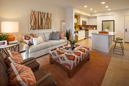 Interior view of a living room and kitchen at Verona at Crescent Village Apartment Homes in San Jose, CA.