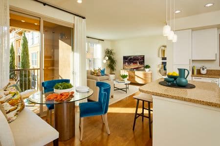 Interior view of Kitchen, Dining Room and Living Room at Crescent Village Apartment Homes in San Jose, CA.