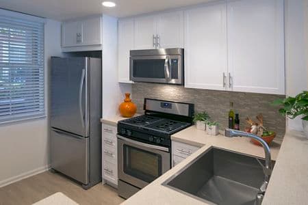 Interior view of kitchen at Franklin Street Apartment Homes in Redwood City, CA.