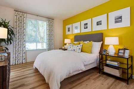 Interior view of a bedroom at The Pines at North Park Apartment Homes in San Jose, CA.