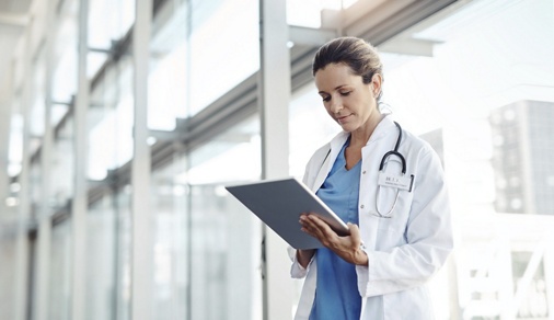 Cropped shot of a female doctor using a digital tablet