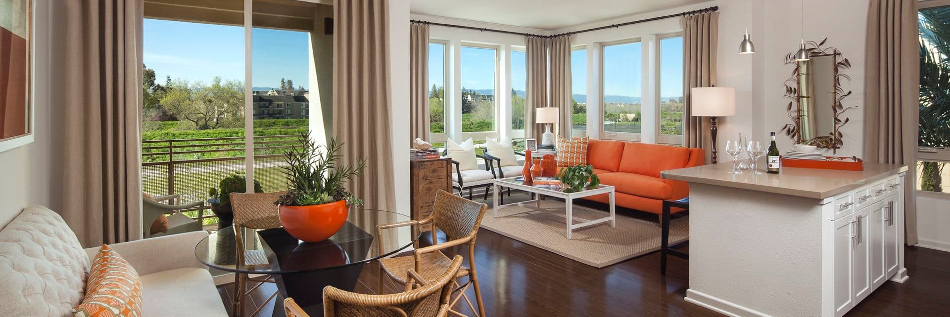 Interior view of living room and dining room at River View Apartment Homes in San Jose, CA.