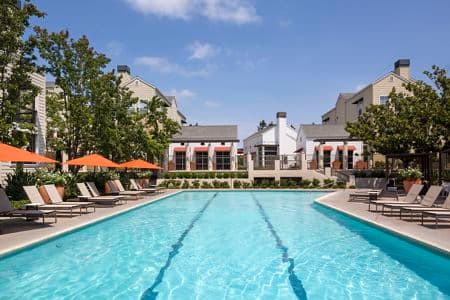 Exterior view of a pool at The Hamptons Apartment Homes in Cupertino, CA. 