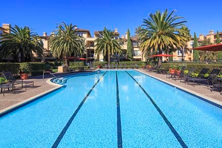 Exterior view of a pool at The Villas at Bair Island Apartment Homes in Redwood City, CA. 