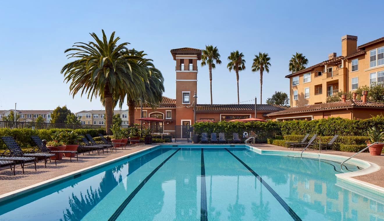 Exterior view of pool at The Villas at Bair Island Apartment Homes in Redwood City, CA.