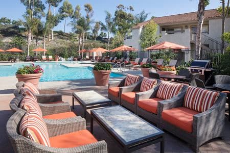 Exterior view of pool at Aliso Town Center Apartment Homes in Aliso Viejo, CA.