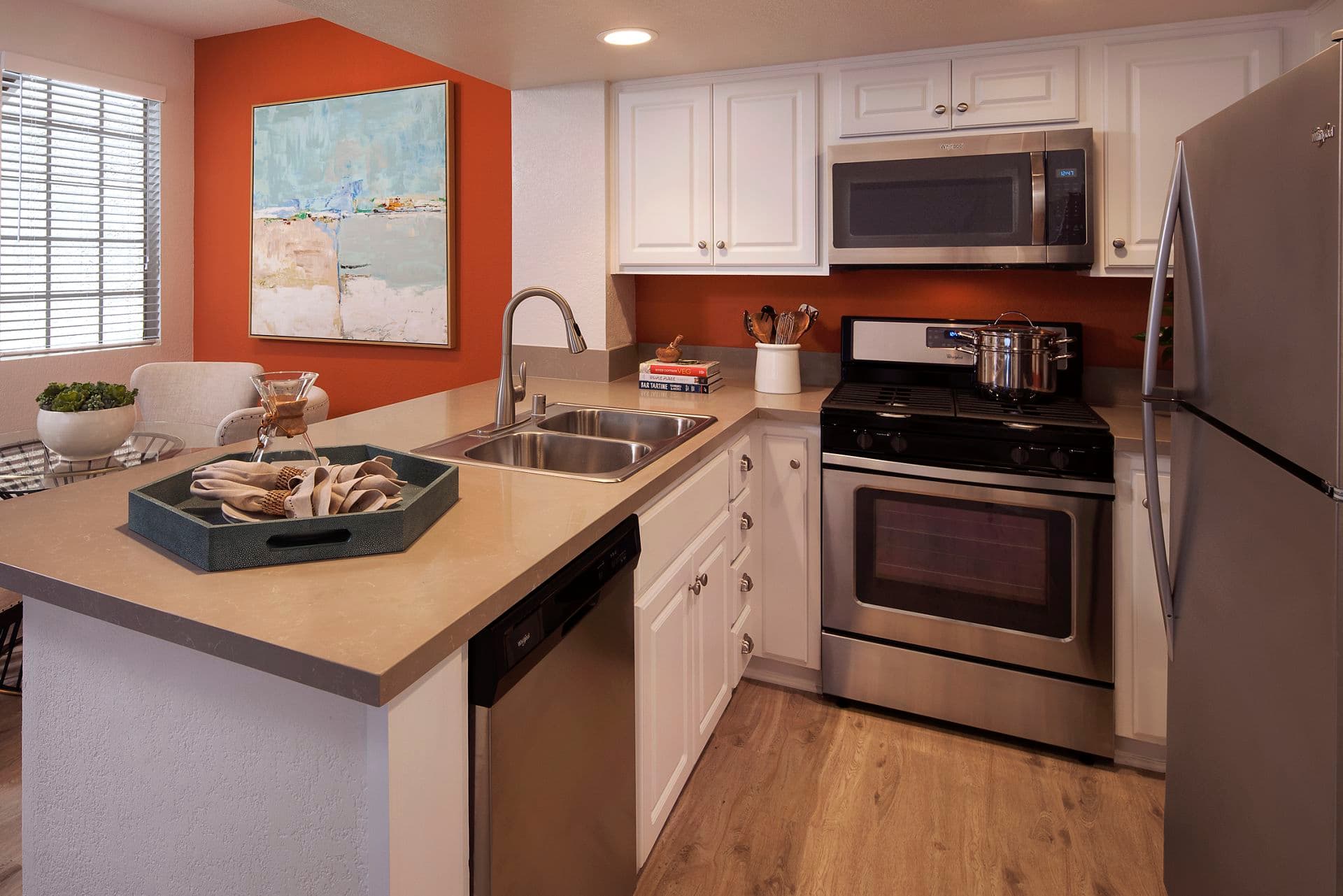 Interior view of kitchen at Aliso Town Center Apartment Homes in Aliso Viejo, CA.