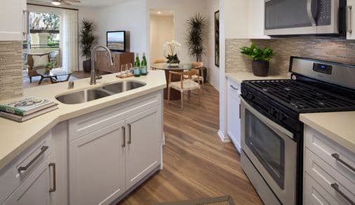Interior view of a kitchen at Vista Bella Apartment Homes in Aliso Viejo, CA. 