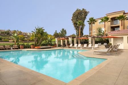 Exterior view of a pool at Vista Bella Apartment Homes in Aliso Viejo, CA. 