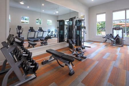 Interior view of the fitness center at Vista Bella Apartment Homes in Aliso Viejo, CA. 
