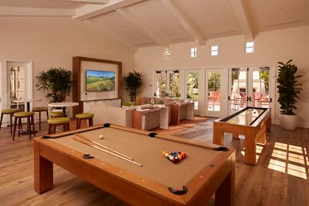 Interior view of Game Center at The Enclave at South Coast Apartment Homes in Costa Mesa, CA.