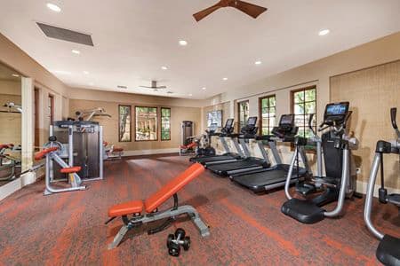 Interior view of fitness center at Anacapa Apartment Homes in Irvine, CA.