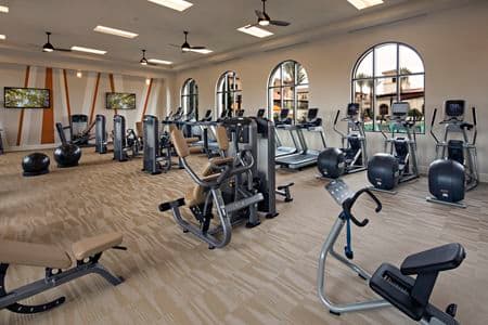 Interior view of fitness center at Avella Apartment Homes in Irvine, CA.