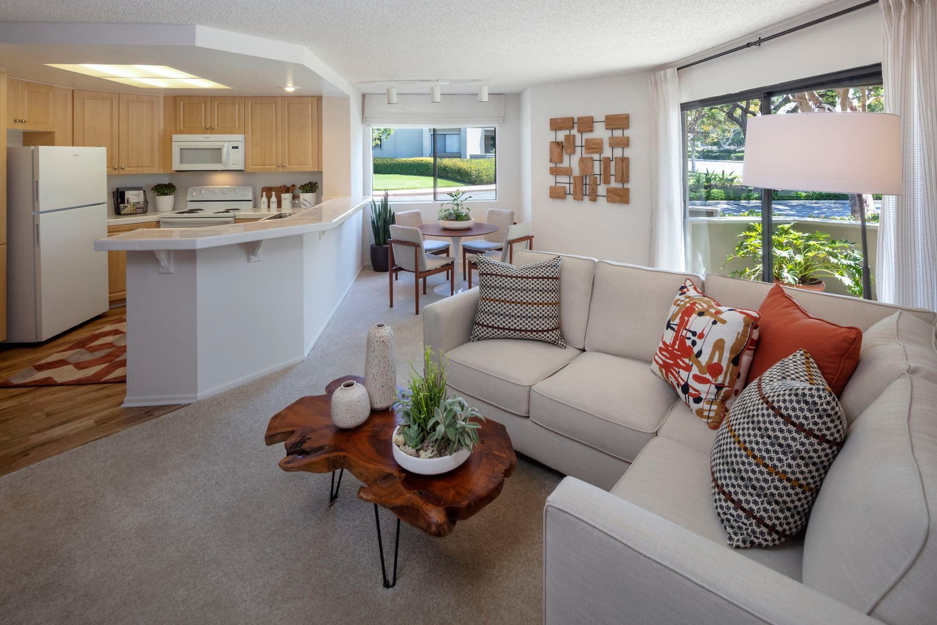 Interior view of living room, dining room and kitchen at Cross Creek Apartment Homes in Irvine, CA.