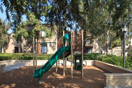 Exterior view of children's playground at Cross Creek Apartment Homes in Irvine, CA.