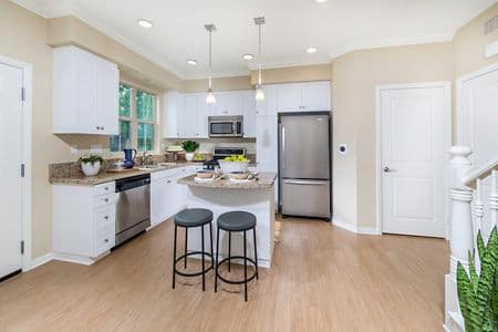 Interior view of kitchen at Cadenza at Cypress Village Apartment Homes in Irvine, CA.