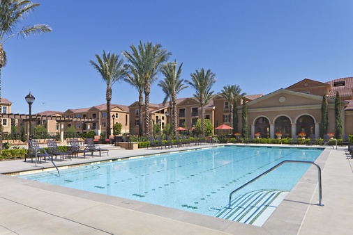 Exterior view of pool at Murano Apartment Homes at Cypress Village in Irvine, CA.