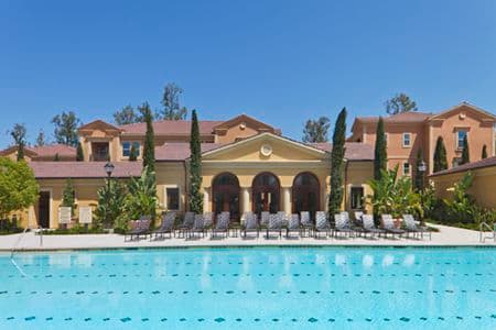 Exterior view of pool at Umbria Apartment Homes at Cypress Village in Irvine, CA.