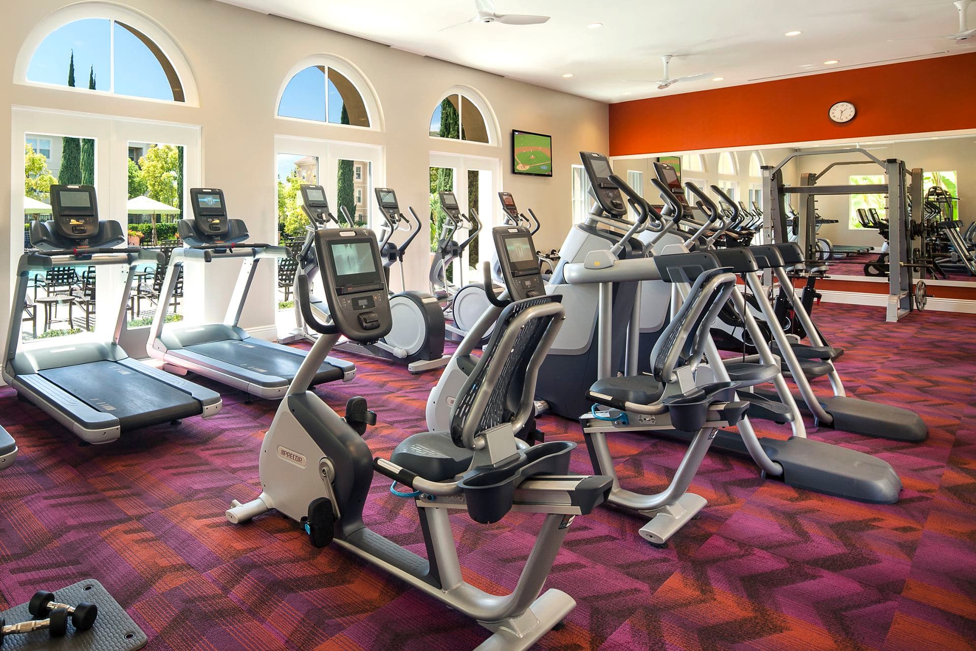 Interior view of fitness center at Umbria Apartment Homes at Cypress Village in Irvine, CA.