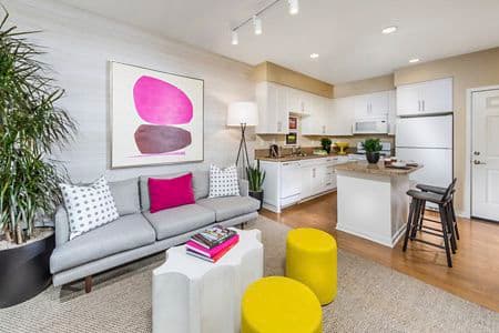 Interior view of living and dining at Umbria Apartment Homes at Cypress Village in Irvine, CA.