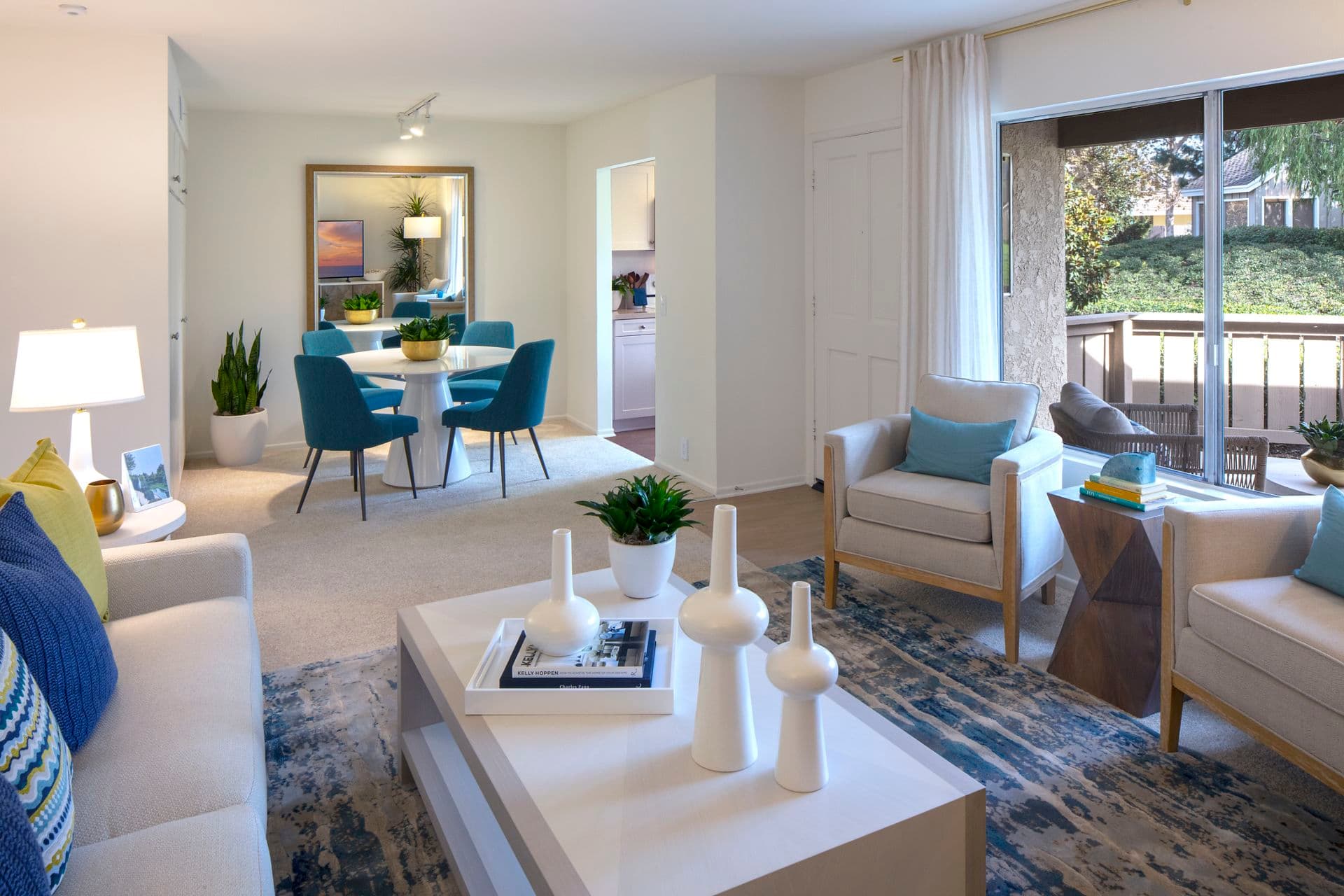 Interior view of living room and dining room atDeerfield Apartment Homes in Irvine, CA.