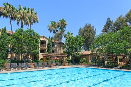 Exterior view of pool at Estancia Apartment Homes in Irvine, CA.