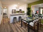 Interior view of kitchen and dining room at Las Palmas Apartment Homes in Irvine, CA.