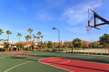 Exterior view of basketball court at Los Olivos Apartment Homes at Irvine Spectrum in Irvine, CA.