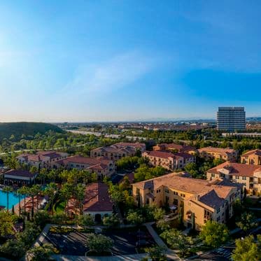 Exterior aerial panorama view of trailside at Los Olivos at Irvine Spectrum Apartment Homes in Irvine, CA.
