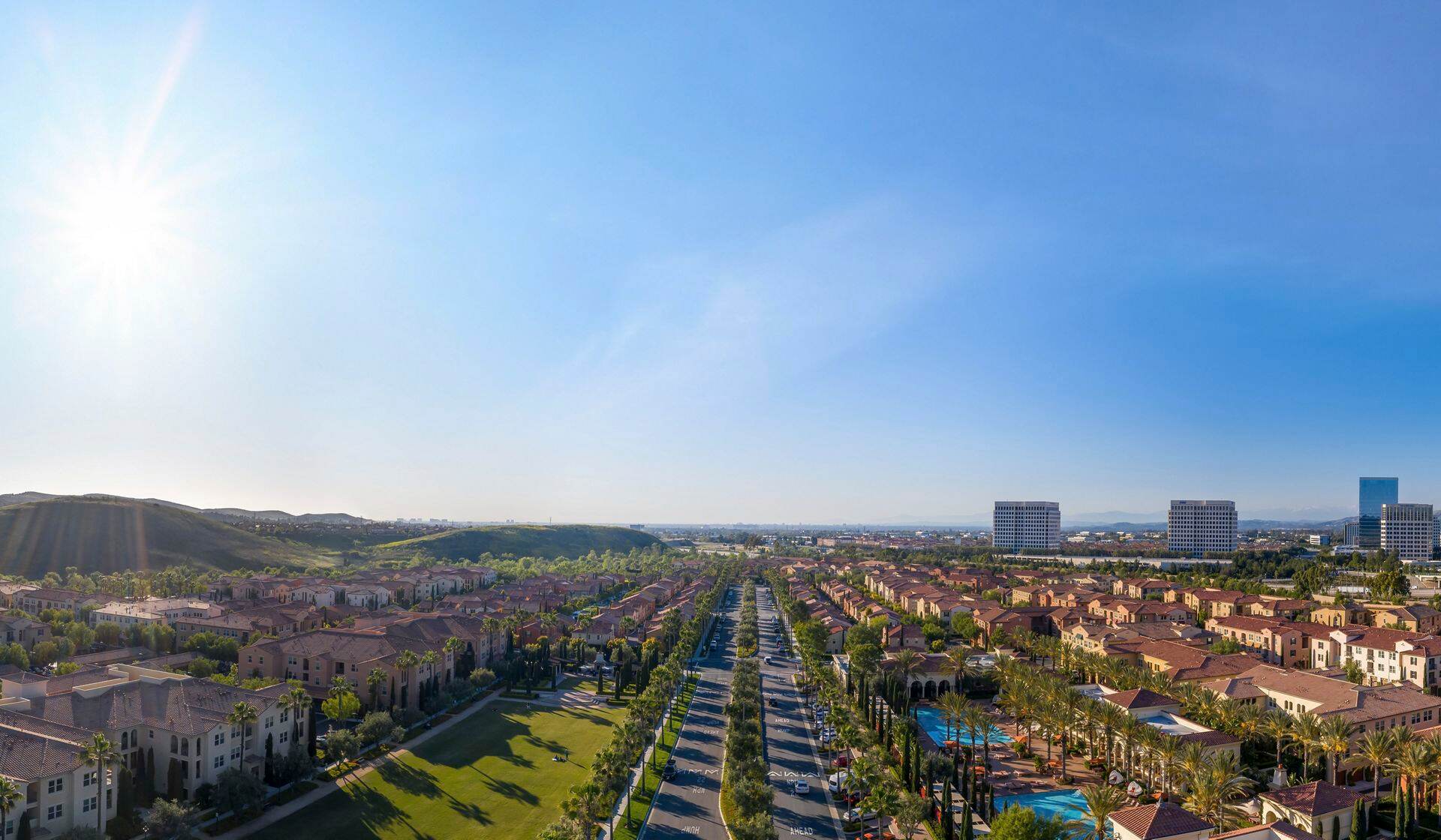 Exterior aerial panorama view of leasing center at Los Olivos at Irvine Spectrum Apartment Homes in Irvine, CA.