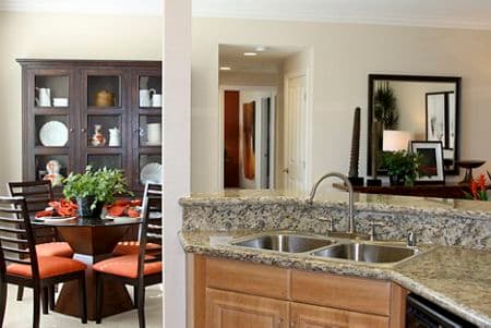Interior view of kitchen and dining room at Mirasol Apartment Homes in Stonegate, Irvine, CA.