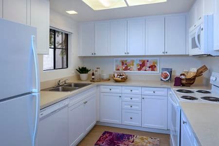 Interior view of kitchen at Northwood Place Apartment Homes in Irvine, CA.