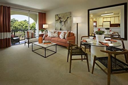 Interior view of living room and dining room at Oak Glen Apartment Homes in Irvine, CA.