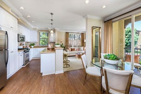 Interior view of kitchen and dining room at Orchard Hills Apartment Homes in Irvine, CA.