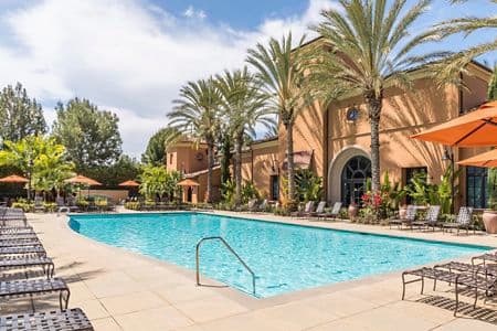 Exterior view of pool at Palmeras Apartment Homes in Stonegate, Irvine, 