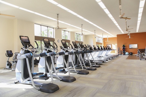 Interior view of fitness center at Park Place Apartment Homes in Irvine, CA.