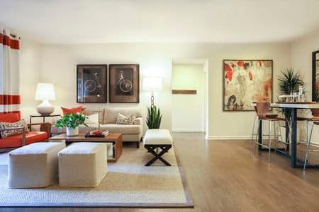 Interior view of living room and dining room at Park Place Apartment Homes in Irvine, CA.