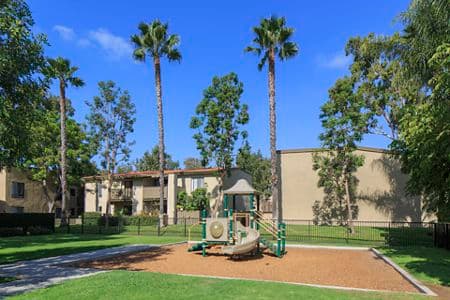 Exterior view of children's play area at Park West Apartment Homes in Irvine, CA.