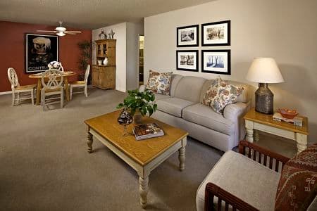 Interior view of living room and dining room at Park West Apartment Homes in Irvine, CA.