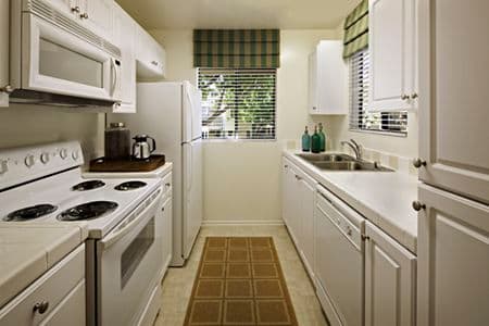 Interior view of kitchen at Parkwood Apartment Homes in Irvine, CA.