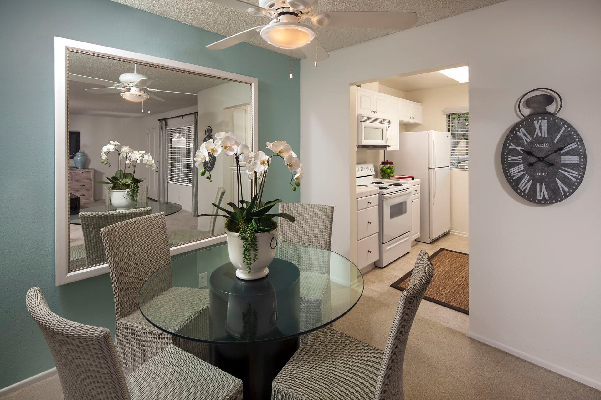 Interior view of dining room and kitchen at Parkwood Apartment Homes in Irvine, CA.