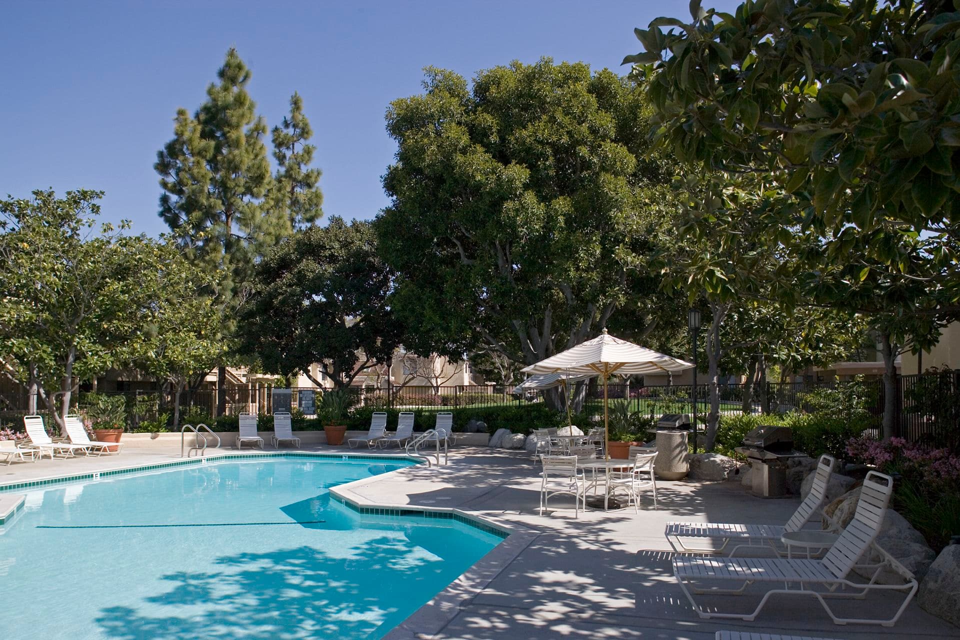 Exterior view of pool at Parkwood Apartment Homes in Irvine, CA.