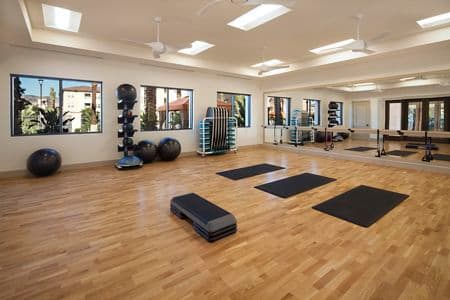 Interior view of fitness center at Portola Court Apartment Homes in Irvine, CA.