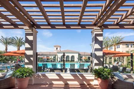 Exterior view of pool at Portola Court Apartment Homes in Irvine, CA.