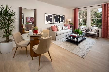 Interior view of living room and dining room at Portola Court Apartment Homes in Irvine, CA.