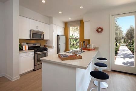 Interior view of kitchen at Portola Court Apartment Homes in Irvine, CA.