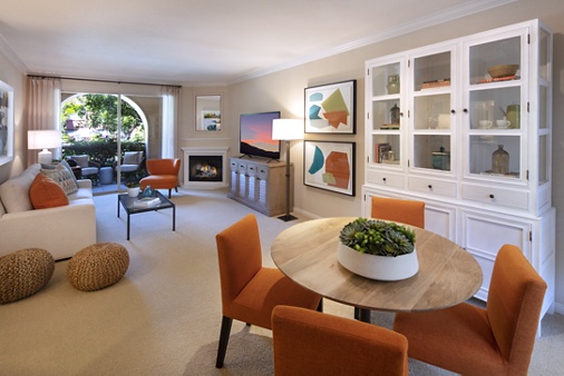 Interior view of dining room and living room at Portola Place Apartment Homes in Irvine, CA.