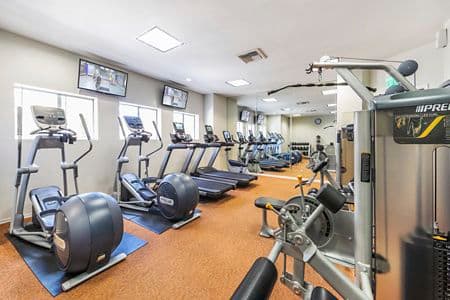 Interior view of fitness center at San Marco Apartment Homes in Irvine, CA.