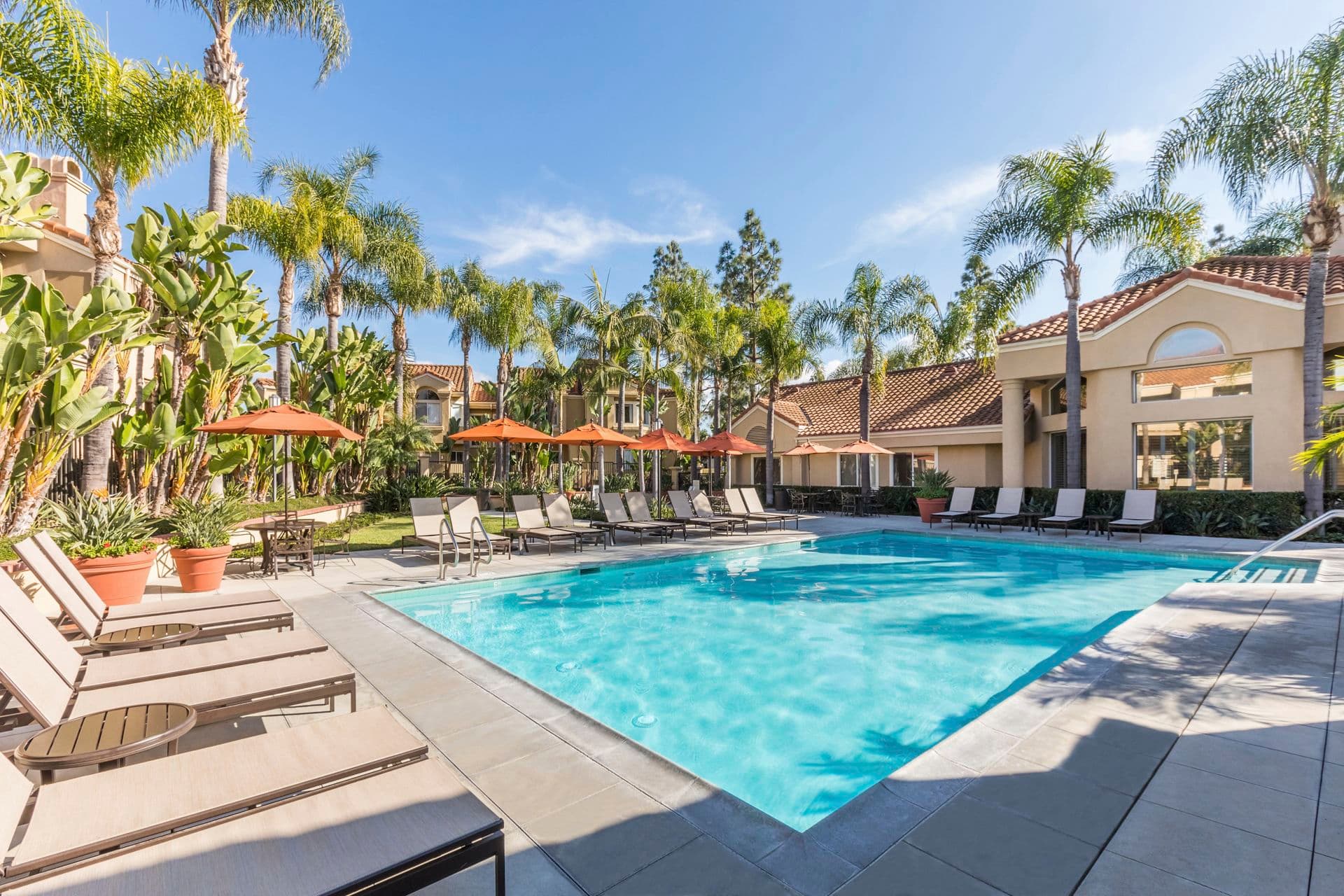 Exterior view of the pool at San Marco Villa Apartment Homes in Irvine, CA.